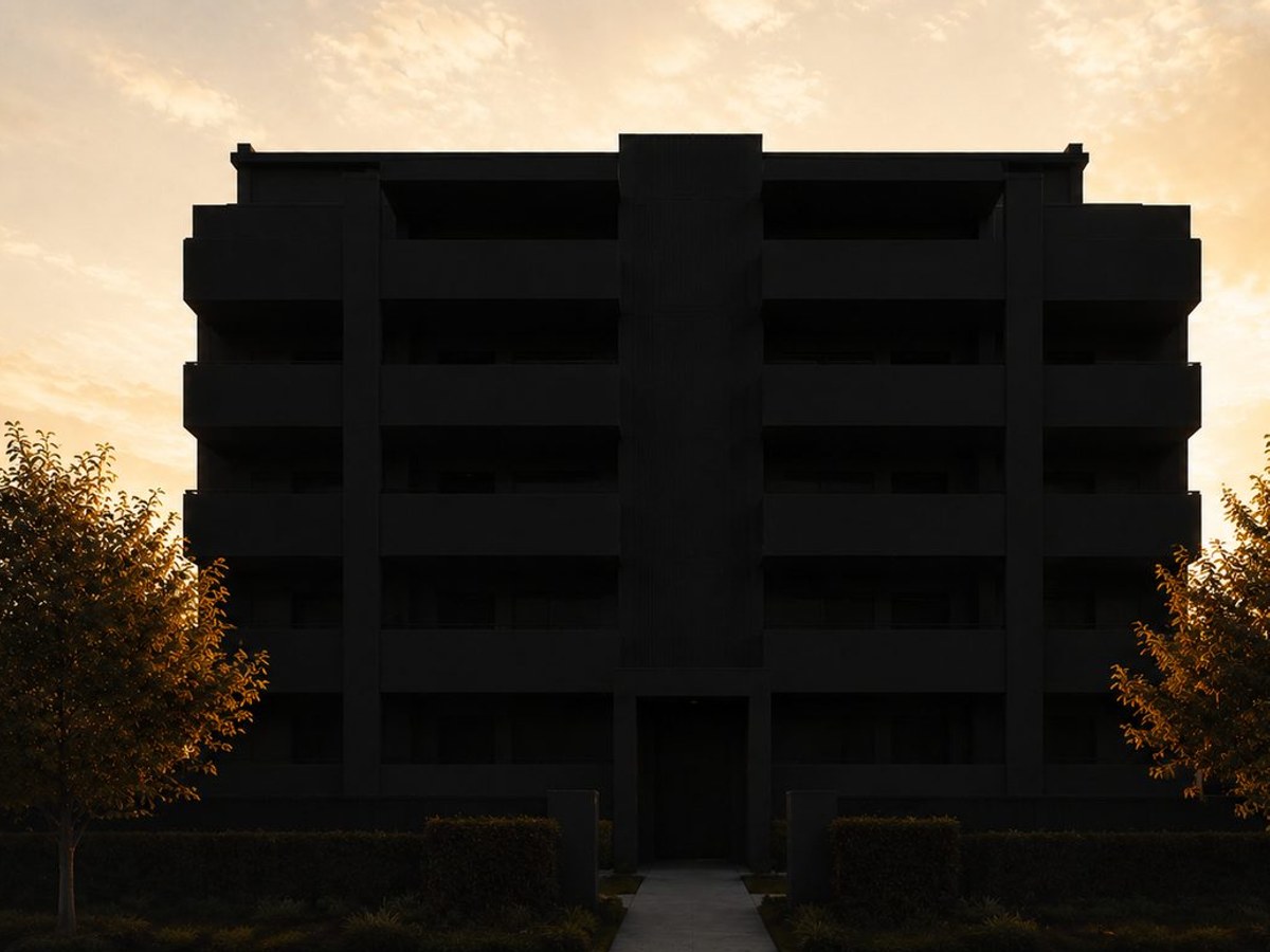 An apartment block in silhouette at dusk, standing in for the withheld Surfers Paradise photo